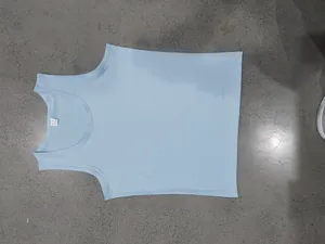 Detailed top view of light blue men's sun-cool cotton gym tank top laid flat