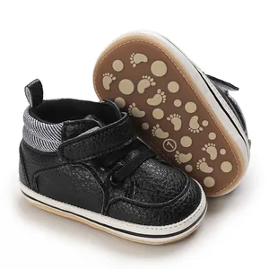 Detailed view of black baby high-top pre-walker shoes featuring non-slip rubber soles