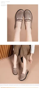 Close-up of women's breathable perforated leather loafers featuring a stylish metal bow