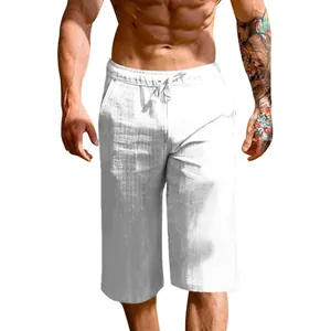 Close-up view of white breathable linen cotton men's cropped pants showing the fabric texture