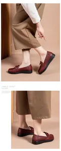 Detail showing wine red perforated loafers for women with soft chunky soles