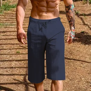 Detail shot of navy blue men's breathable linen cotton casual cropped trousers outdoors