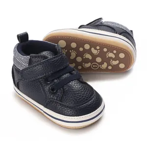 Detail view of navy blue high-top baby walking shoes featuring soft rubber anti-slip soles