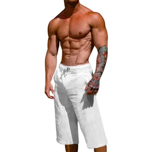 Close-up of white breathable linen cotton men's cropped pants with drawstring waist.