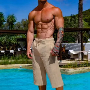 Breathable men's loose linen cotton cropped pants shown on a model by a resort pool