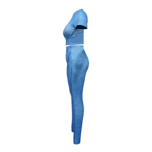 Side view of blue ribbed two-piece sports set with round neck crop top and leggings.