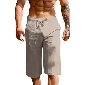 Close-up of men's loose linen drawstring capris in beige for summer casual wear