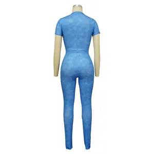 Back view of women's blue ribbed tie-dye sports set with short sleeves and leggings