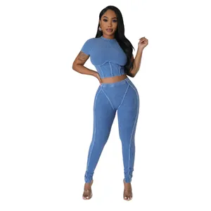 Blue ribbed two-piece set featuring a crew neck crop top and high-waisted leggings