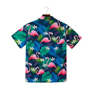 Detailed view of the vibrant tropical flamingo and palm leaf print on beach shirt