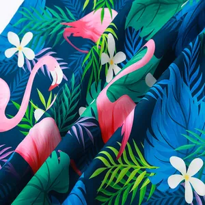 Detailed macro view of tropical flamingo and palm leaf print fabric for beach shirts