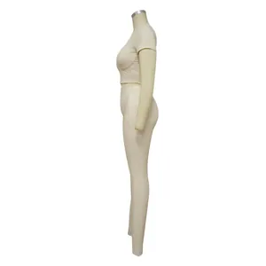 Side profile of a beige ribbed two-piece yoga set with cropped top and leggings