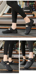 Detail showing breathable black water shoes worn for fitness workout in a gym.