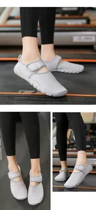 Detailed view of grey breathable mesh water shoes with adjustable strap on a treadmill