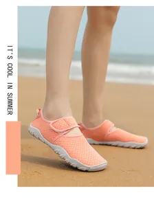 Side view detail of breathable orange mesh water shoes for beach and outdoor swimming