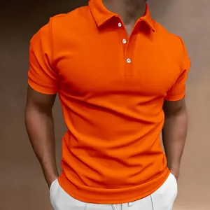Close-up detail of men's bright orange short sleeve polo shirt with white buttons.