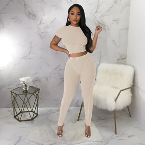Sexy ribbed two-piece sports set featuring a tight crew neck crop top and leggings