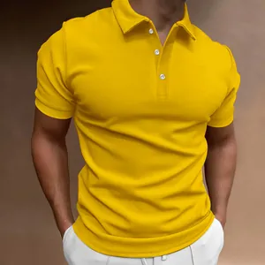 Close-up detail of a bright yellow slim fit men's polo shirt with white buttons