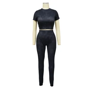 Detailed view of women's ribbed two-piece sports set with marbled tie-dye pattern