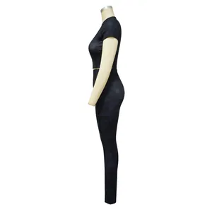 Side view of black ribbed two-piece athletic set with crop top and leggings