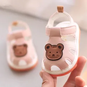 Cute pink baby sandals with cartoon bear design and soft non-slip sole for summer