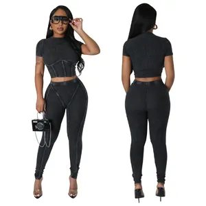 Detailed front and back view of a black ribbed two-piece set featuring crop top and leggings