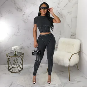 Detail view of ribbed gray two-piece crop top and leggings set for women's fitness
