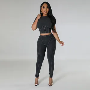 Full view of black ribbed two-piece yoga set featuring cropped top and leggings