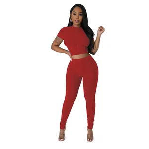 Close-up of a red ribbed round-neck two-piece athletic set for women