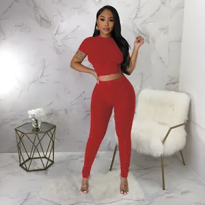 Sexy red ribbed two-piece sportswear set featuring short sleeve crop top and leggings