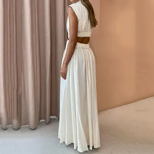 Back view detail of a summer white cut-out maxi dress with high waist design