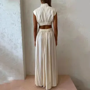 Back view of a chic cream cutout maxi dress featuring a high neck and waist detail.