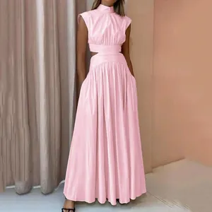 Detail of pink summer maxi dress featuring high neck and stylish waist cut-outs