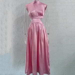 Detail view of the pink satin waist-baring maxi dress on a clear mannequin