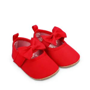 Zapatos rojos de princesa para bebé con suela blanda y un lazo decorativo muy grande