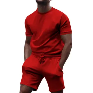 Comfortable men's red sports two-piece set with t-shirt and drawstring shorts detail.
