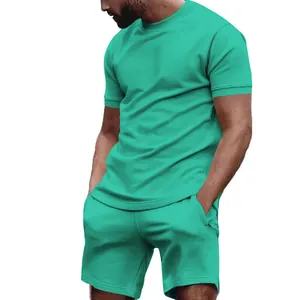 Detailed view of men's summer two-piece casual sports set in vibrant teal color