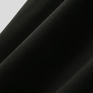 Close-up macro shot of soft black knitted fabric texture for men's T-shirt