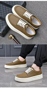 Detail view of British style brown leather sneakers for men with thick white soles
