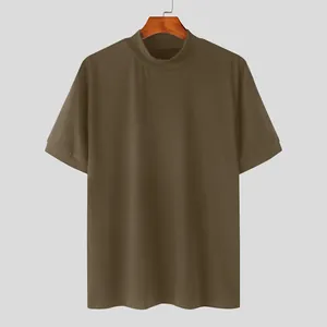 Close-up of a men's olive green mock neck short sleeve T-shirt with a solid finish