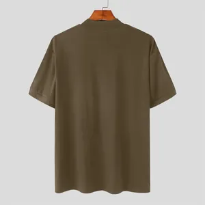 Detailed back view showing the clean tailoring of a men's brown high collar T-shirt