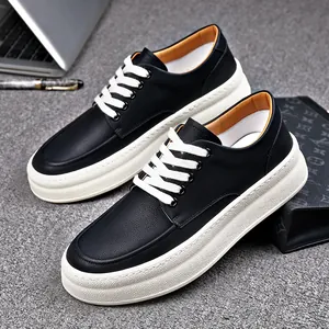 Stylish men's black leather thick-sole casual shoes with white laces and tan lining.
