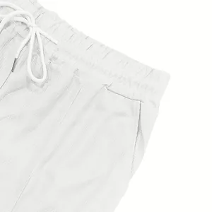 Vista dettagliata dei pantaloncini in maglia a nido d'ape bianca con coulisse elastica