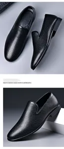 Close-up detail showing the breathable perforated texture of black leather loafers.