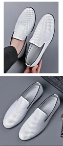 Close-up of men's white perforated leather loafers with breathable hole details.