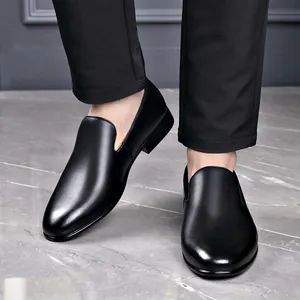 Elegant black genuine leather slip-on dress shoes for men with classic pointed toe design