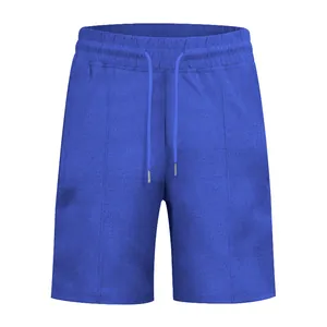 Vista dettagliata dei pantaloncini da uomo in maglia a nido d'ape blu con coulisse
