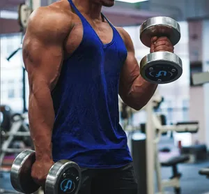 Macro view of a men's blue cotton stringer tank top for professional gym fitness workouts