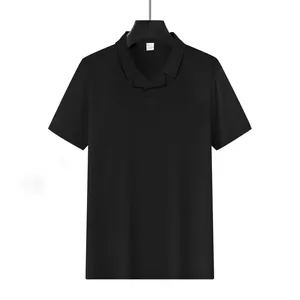 Detailed view of black waffle knit men's Polo shirt featuring minimalist Burke collar