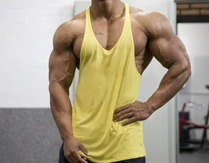 Close-up detail of yellow cotton stringer tank top on a muscular male model for gym